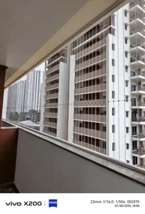 Invisible grills installation on apartment balcony in Chennai with city view