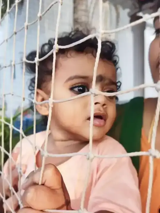 Child protected by safety net installation at family apartment in Adyar Chennai