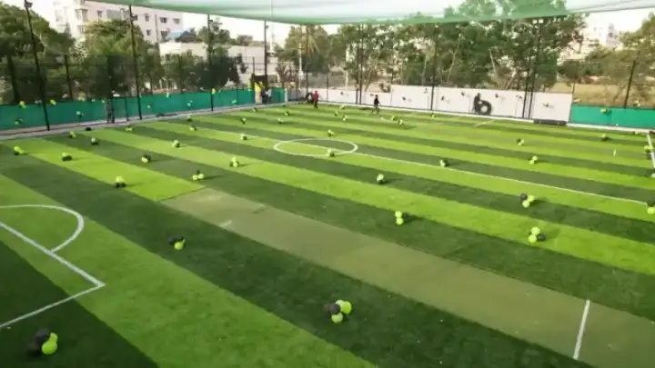 Professional football turf with sports net enclosure in Chennai sports facility